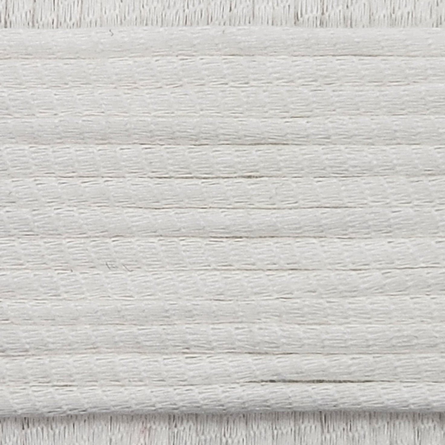 A close-up image showing the texture of a milky white coloured yarn that is friendly for crochet beginners.