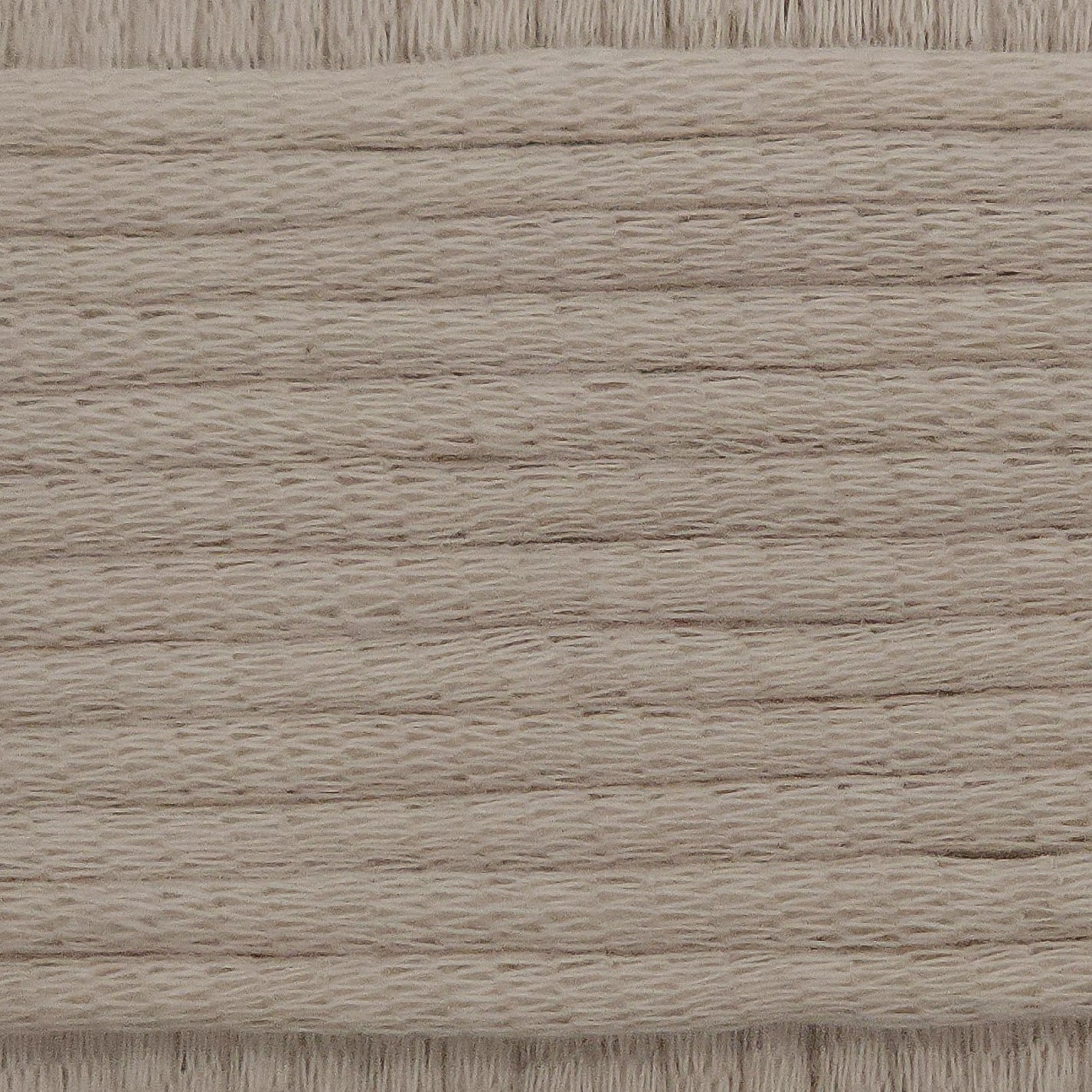 A close-up image showing the texture of an almond nude coloured yarn that is friendly for crochet beginners.