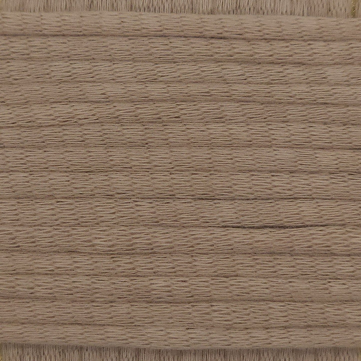 A close-up image showing the texture of a milktea brown coloured yarn that is friendly for crochet beginners.