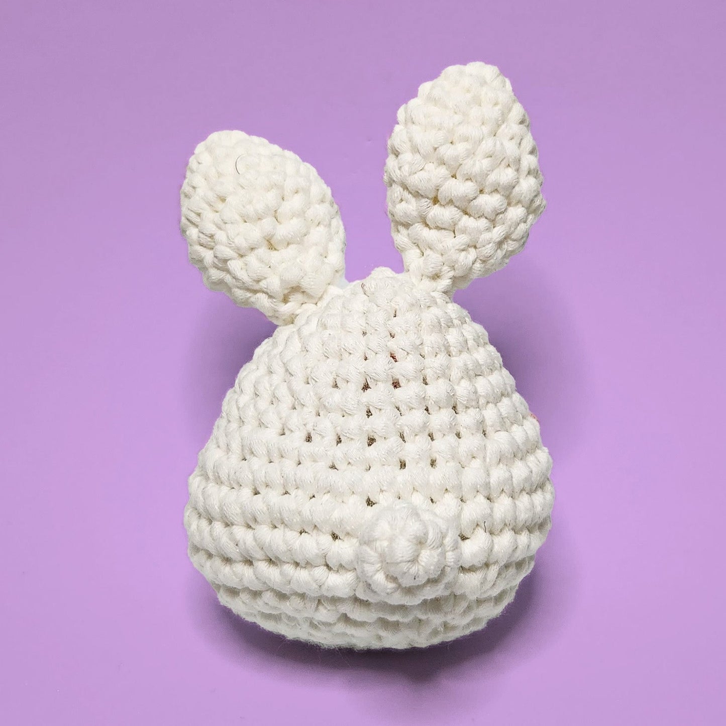 White bunny crochet amigurumi, handmade from our beginner crochet kit. Perfect as a handmade gifts for friends. Back view.