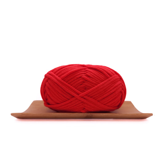 A skein of chilli red coloured yarn for crochet beginners.