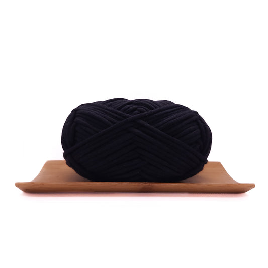 A skein of deep black coloured yarn for crochet beginners.
