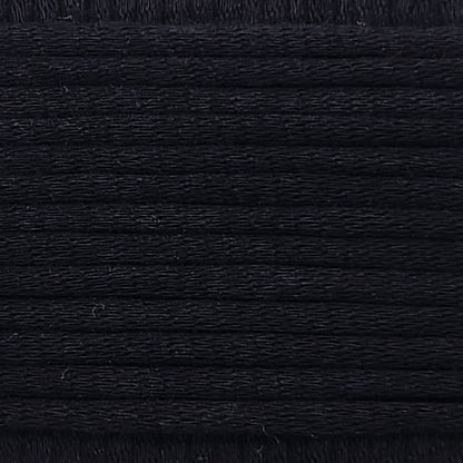 A close-up image showing the texture of a deep black coloured yarn that is friendly for crochet beginners.