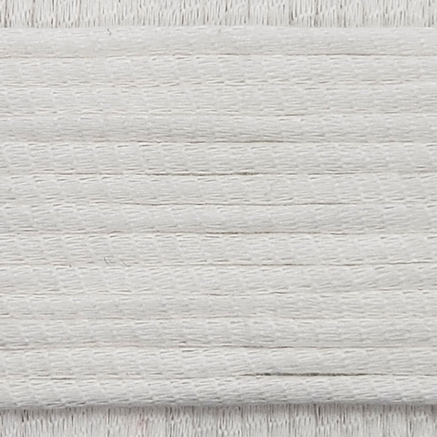 A close-up image showing the texture of a milky white coloured yarn that is friendly for crochet beginners.
