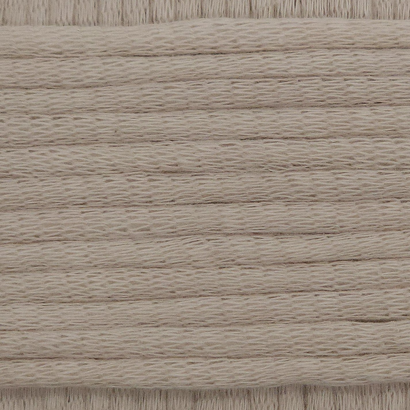 A close-up image showing the texture of an almond nude coloured yarn that is friendly for crochet beginners.