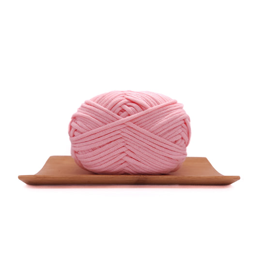 A skein of baby pink coloured yarn for crochet beginners.
