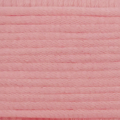 A close-up image showing the texture of a baby pink coloured yarn that is friendly for crochet beginners.