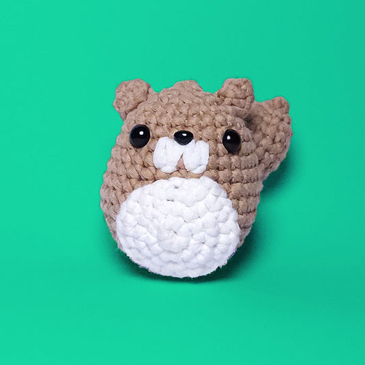 Cute beaver amigurumi, crafted from our beginner-friendly crochet kit. Perfect for crochet enthusiasts looking to create adorable projects. Front view showcasing its charming design.