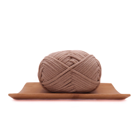 A skein of milktea brown coloured yarn for crochet beginners.