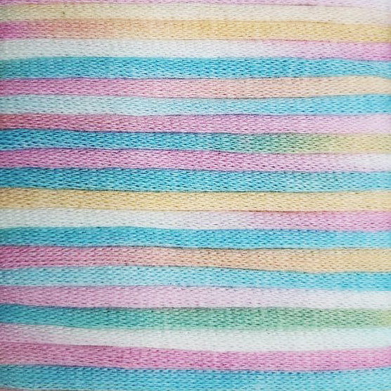 A zoomed-in version of a yarn that is coloured like neopolitan ice-cream.