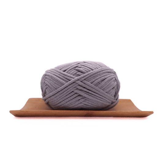 A skein of soft grey coloured yarn for crochet beginners.