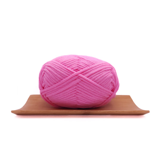 A skein of summer pink coloured yarn for crochet beginners.