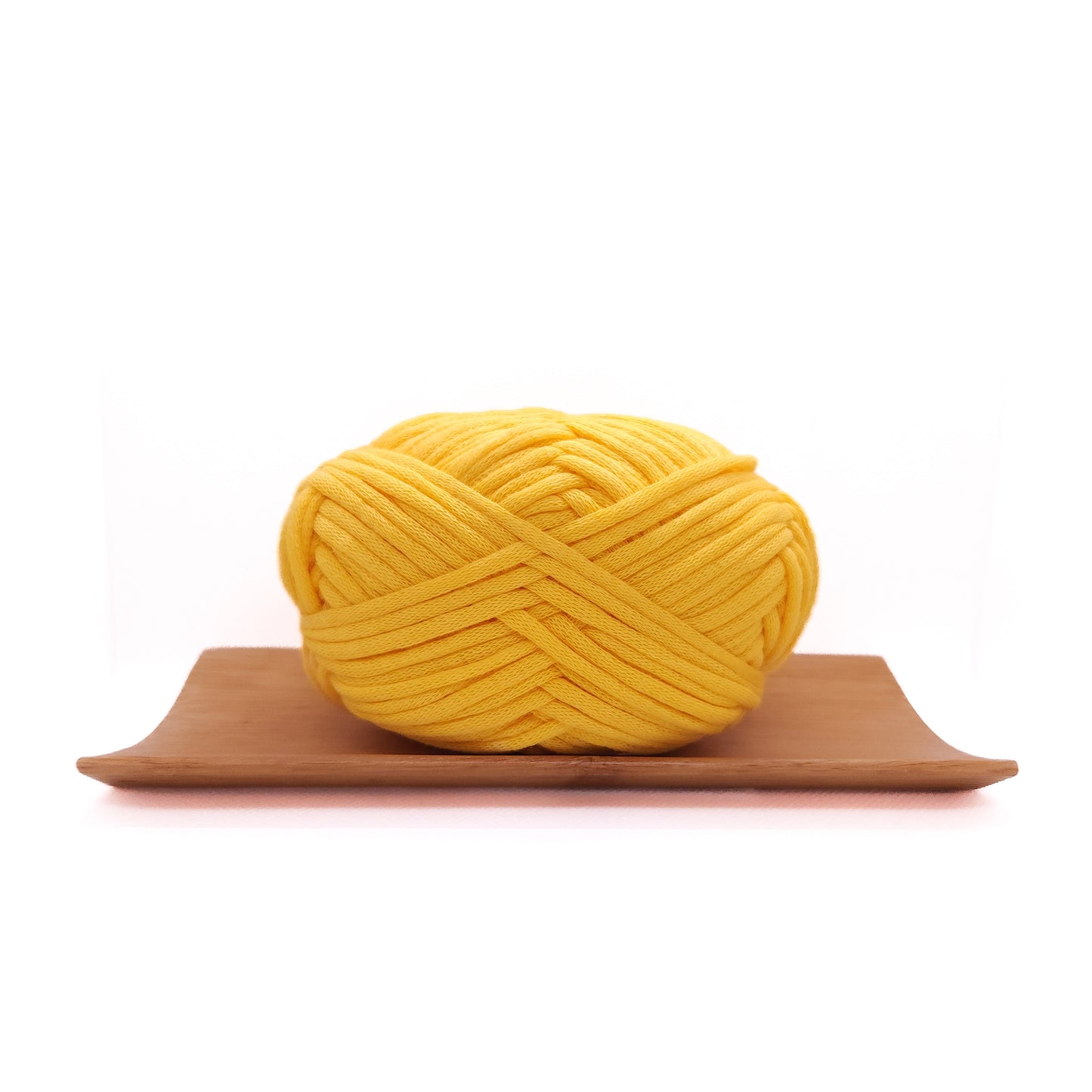 A skein of sunshine yellow coloured yarn for crochet beginners.